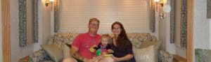 Liz Wilcox and her family pose for a photo in the RV
