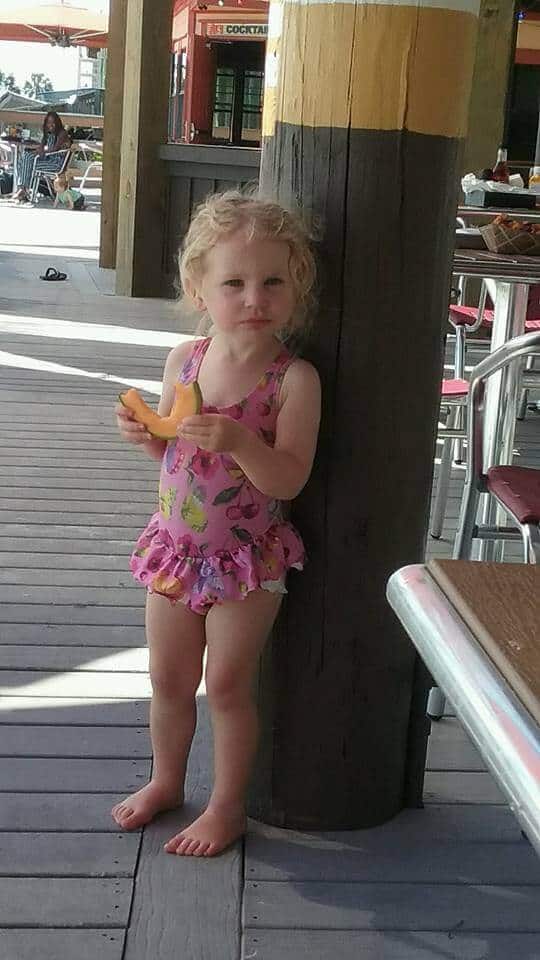 Chelsea Wilcox eats on the beach in florida